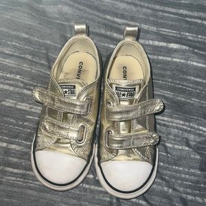Gold and white converse